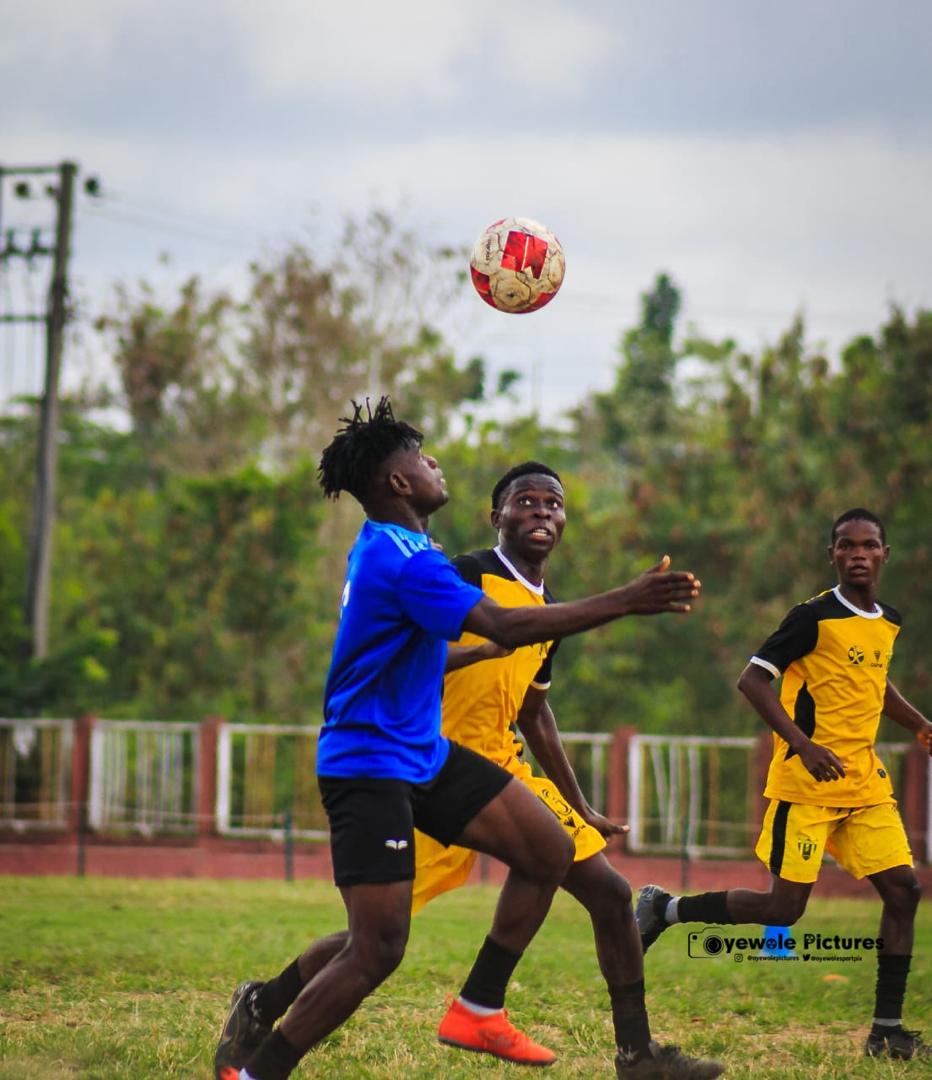 KEDOPEACH players contesting the ball in the air near goal