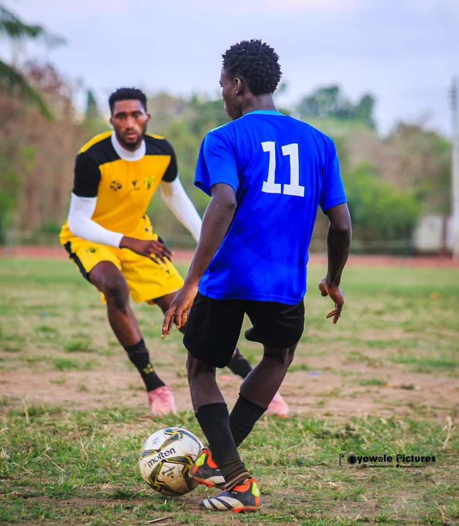 KEDOPEACH player dribbling past an opponent during a match