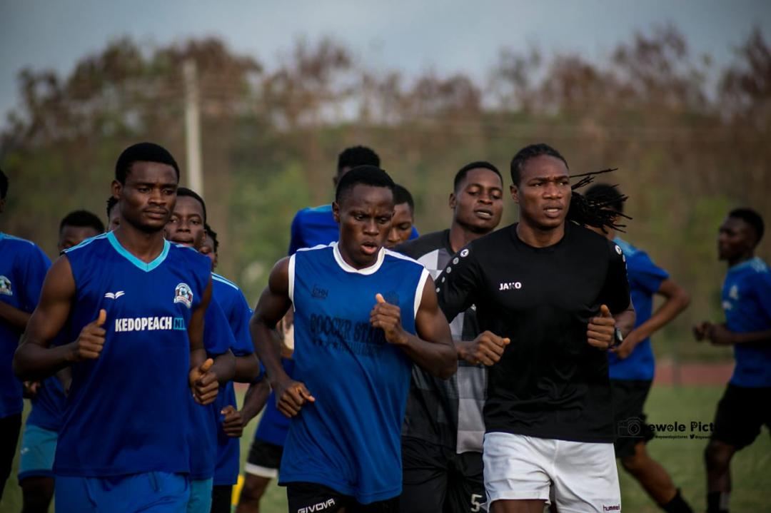 KEDOPEACH players jogging during a warm-up session