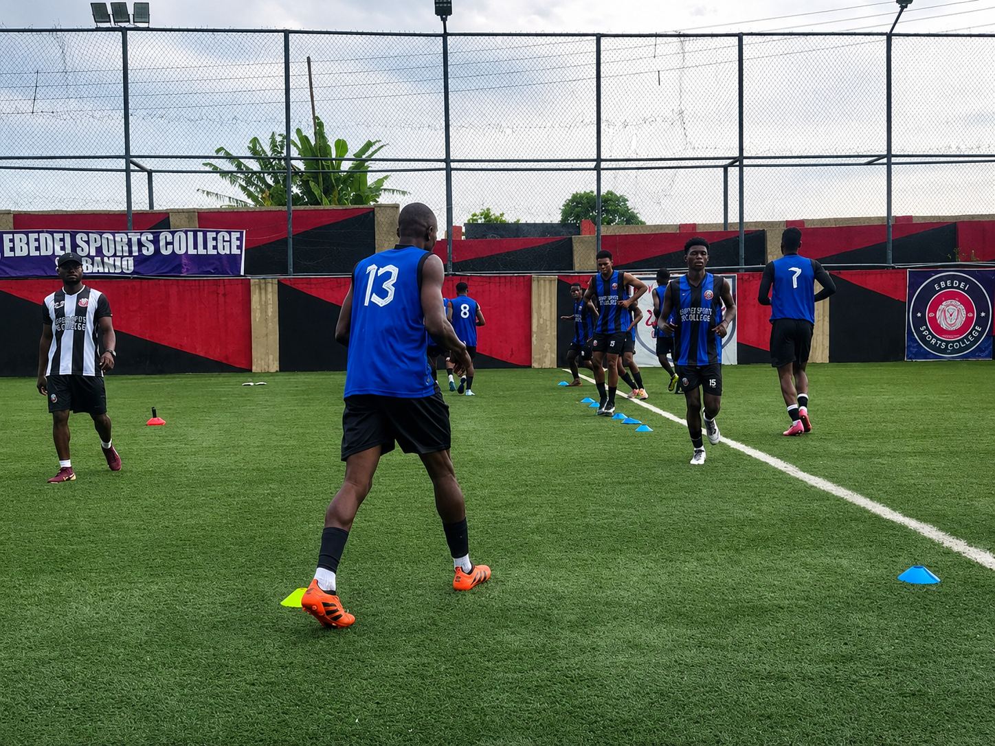 Players warming up during a KEDOPEACH training session